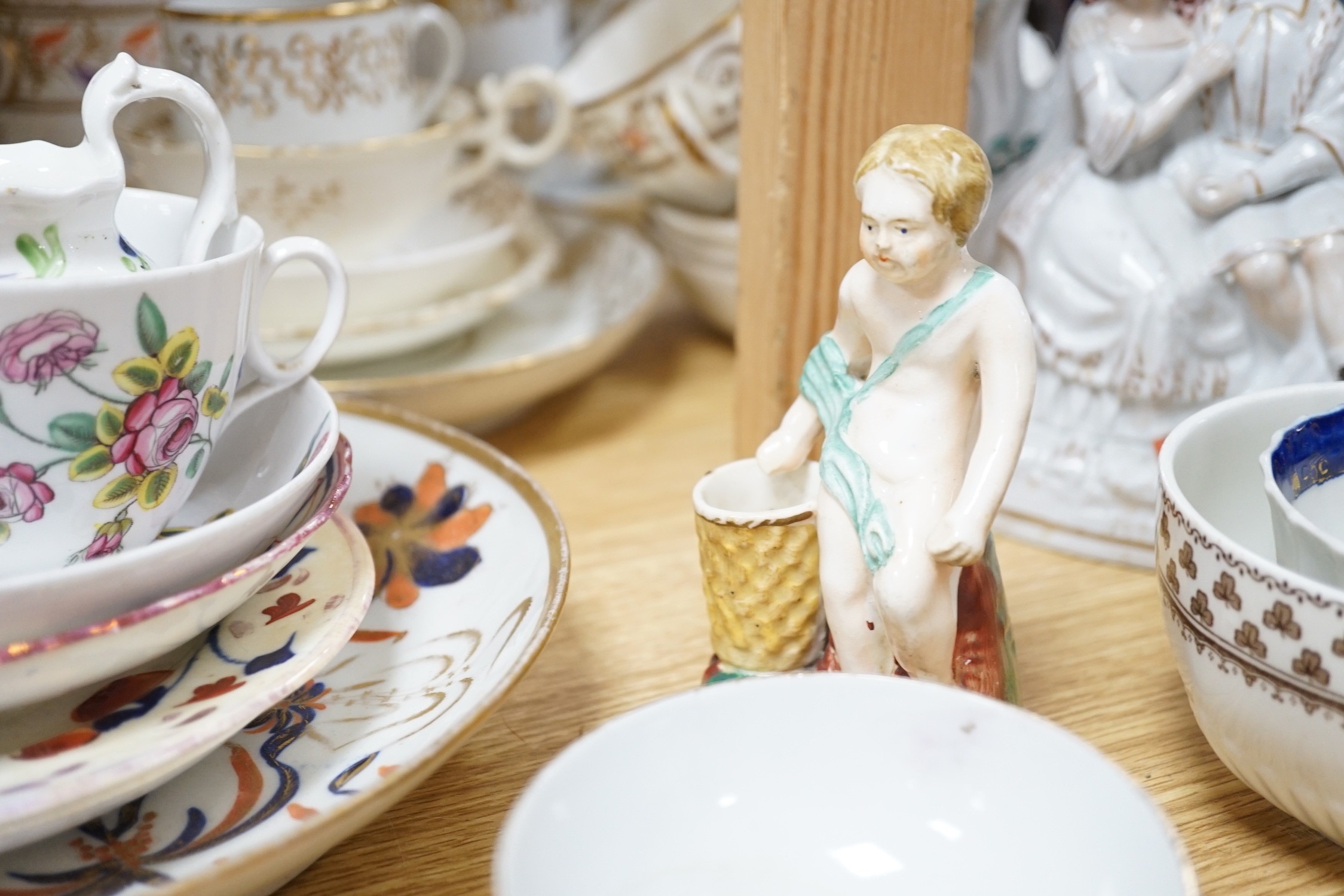 A large collection of mixed 19th century tea ware, a Staffordshire flat back, floral encrusted vase